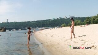 Bombastic young nudist babes sunbathe nude at the beach