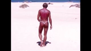 Tanned guy on beach in tiny string thong (temporarily!)