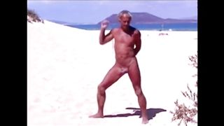 Tanned guy on beach in tiny string thong (temporarily!)