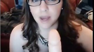 Nerdy Chick with glasses sucking dildo and masturbating